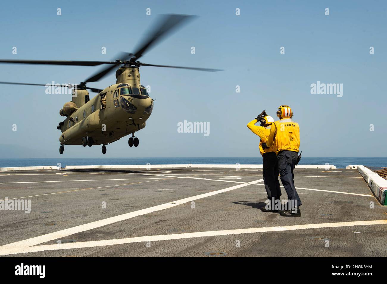 210828-N-MD802-1206  CARIBBEAN SEA -(Aug. 28, 2021) — A U.S Army CH-47 Chinook helicopter, assigned to Bravo Company, 1st Battalion, 228th Aviation Regiment conducts deck landing qualifications aboard the San Antonio-class amphibious transport dock ship USS Arlington (LPD 24), Aug. 28, 2021. Arlington is deployed to U.S. Naval Forces Southern Command/U.S. 4th Fleet to support humanitarian assistance and disaster relief (HADR) efforts in Haiti following a 7.2-magnitude earthquake on Aug. 14, 2021. Stock Photo