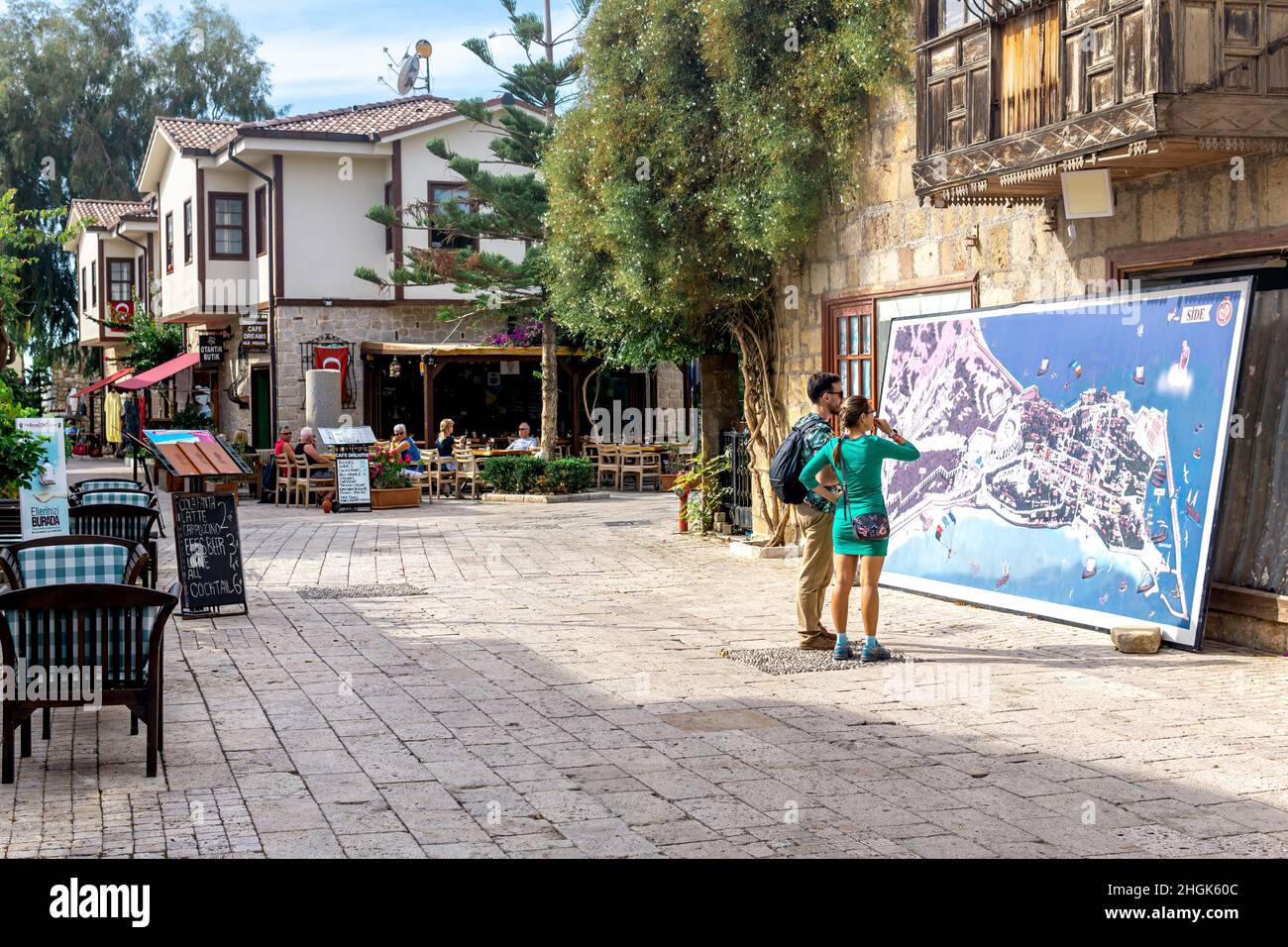 Manavgat, Turkey - November 13, 2021: tourists look at the map of the historical area of Side Stock Photo