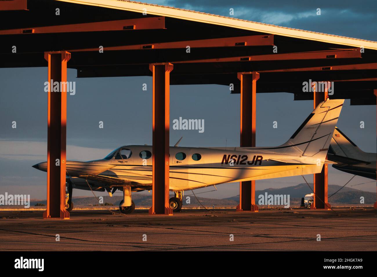 a Cessna 340A propeller aircraft parked under shelter at Sierra Blanca Regional Airport, New