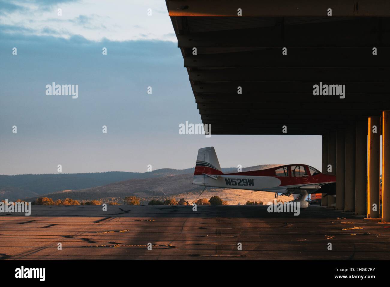 a Vans RV10 propeller aircraft parked under shelter at Sierra Blanca Regional Airport, New