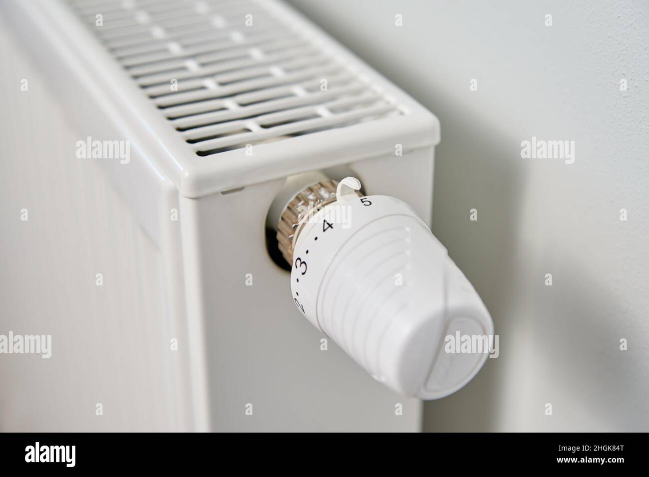 Adjusting temperature on heating radiator thermostat, Turning heat ...