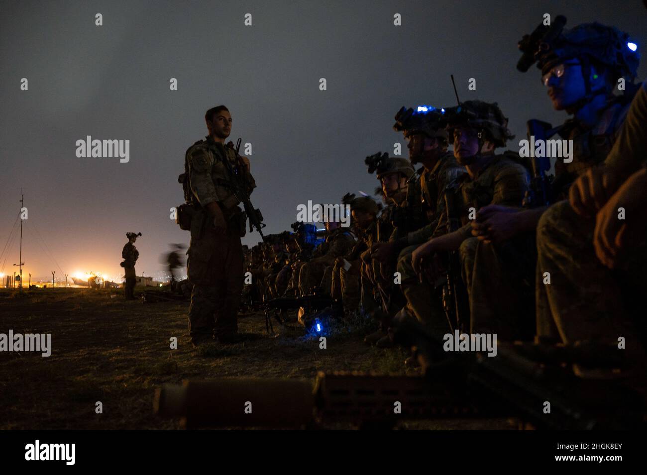 U.S. Soldiers, assigned to the 82nd Airborne Division, prepare to board ...