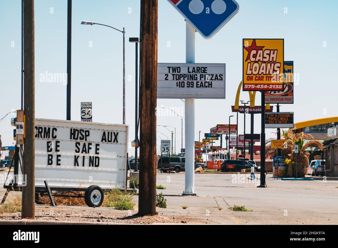 The main street littered with fast food and loan signage in Alamogordo, New Mexico, United States Stock Photo