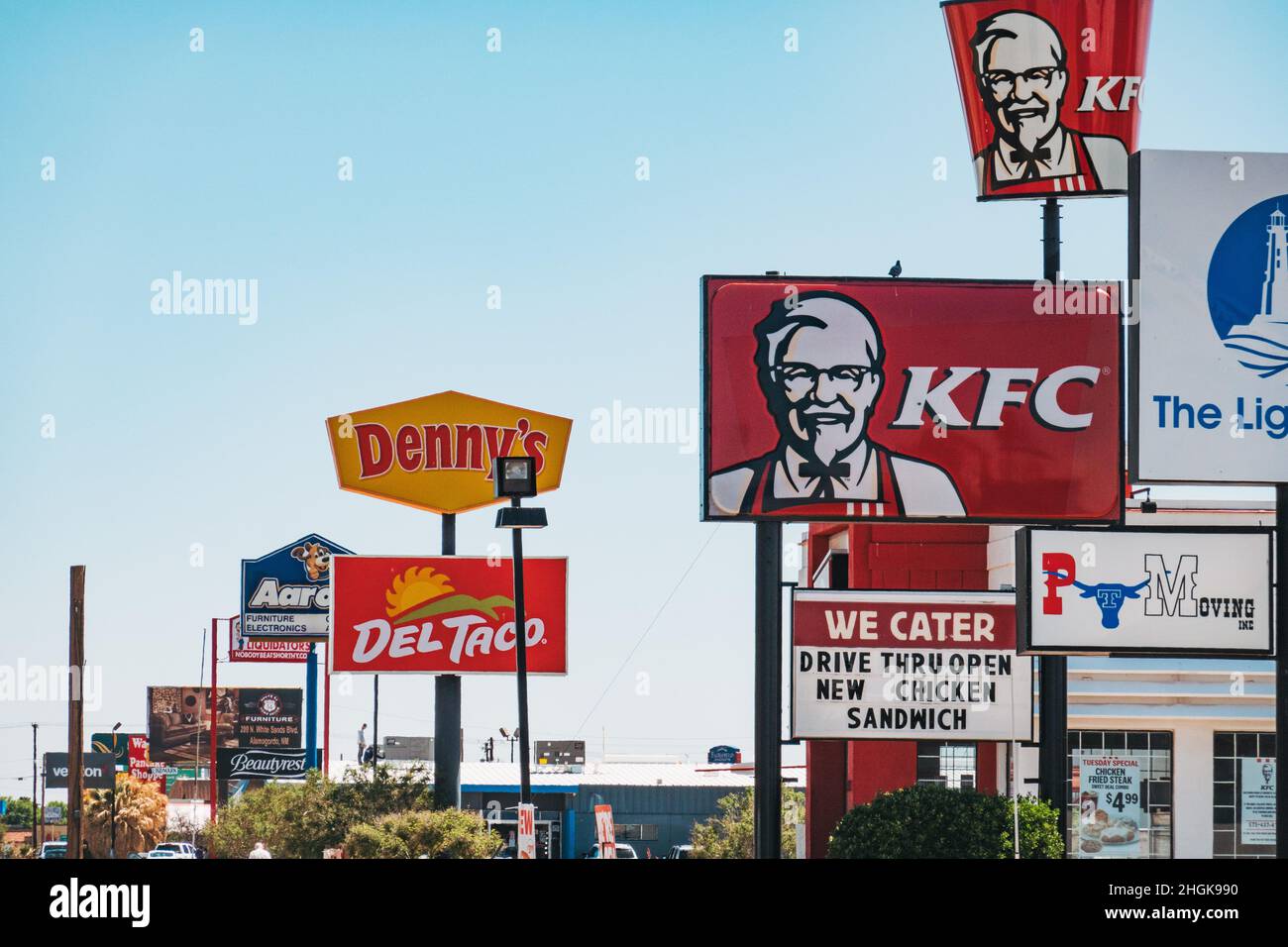 The main street littered with fast food restaurant signage in Alamogordo, New Mexico, United