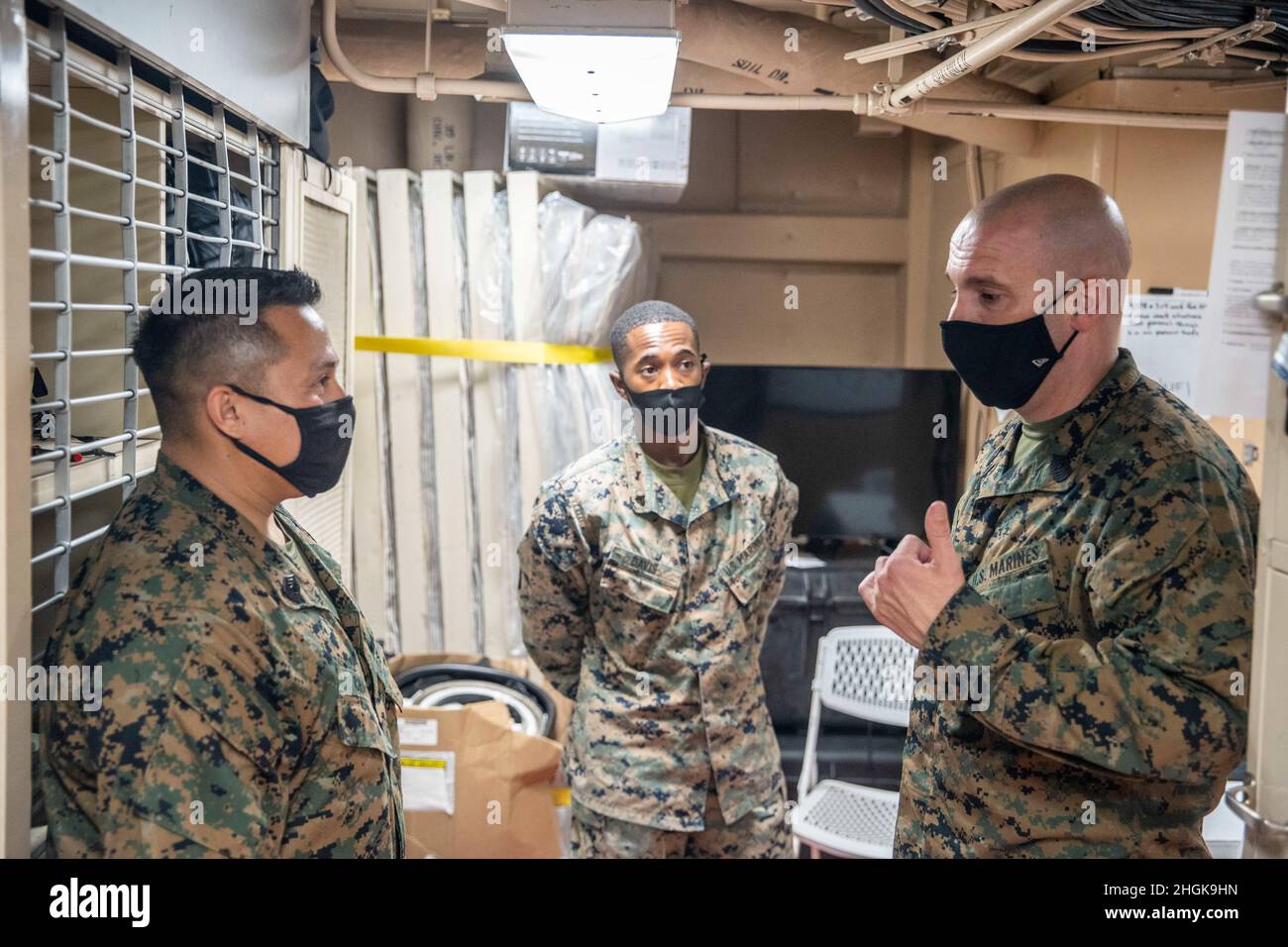 U.S. Marine Corps Sgt. Maj. Travis DeBarr, right, the 11th Marine ...