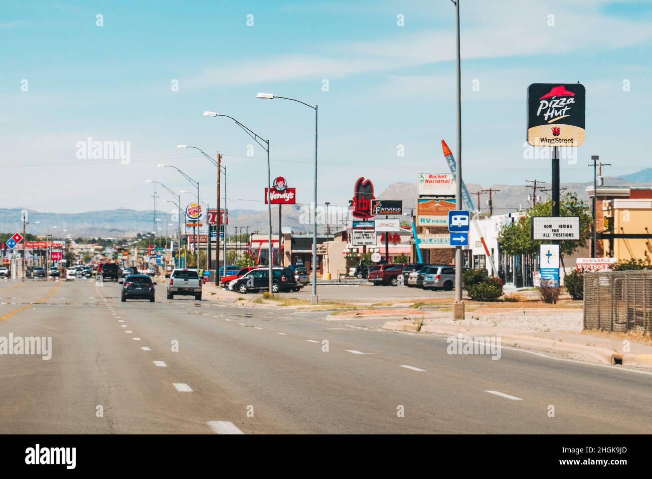 The main street littered with fast food restaurant signage in Alamogordo, New Mexico, United States Stock Photo