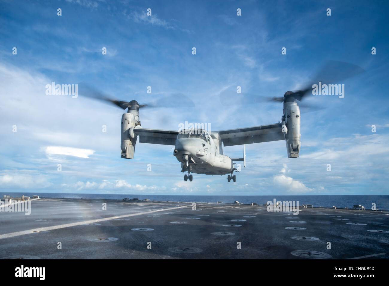 A U.S. Marine Corps MV-22B Osprey assigned to Marine Medium Tiltrotor Squadron (VMM) 165 (Rein.), 11th Marine Expeditionary Unit, takes off from the flight deck of amphibious dock landing ship USS Pearl Harbor (LSD 52), Aug. 31, 2021. Pearl Harbor, part of the USS Essex Amphibious Ready Group, along with the 11th MEU, is operating in the U.S. 7th Fleet area of responsibility to enhance interoperability with allies and partners and serve as a ready response force to defend peace and stability in the Indo-Pacific region. Stock Photo
