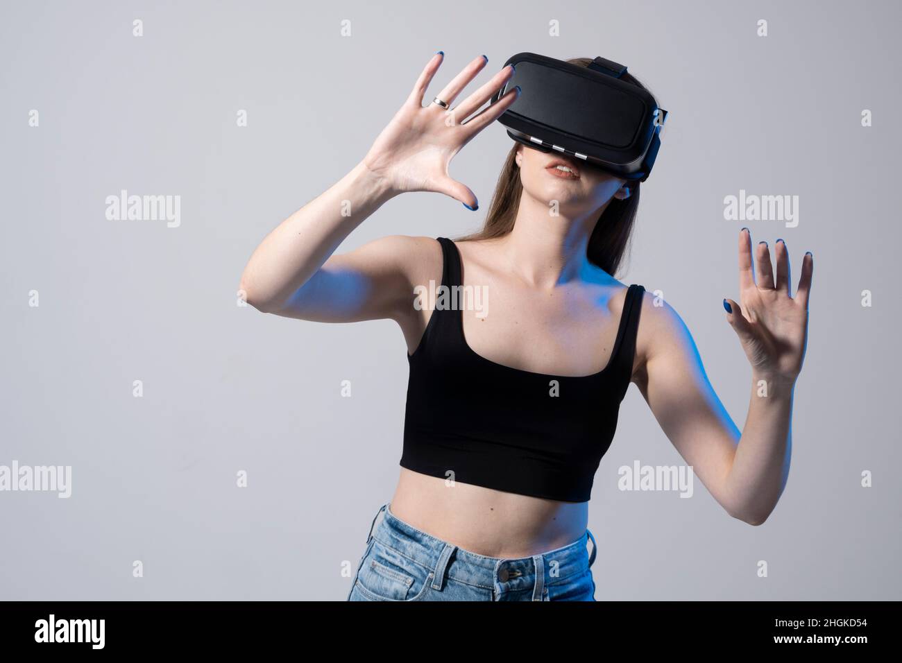 Happy brunette girl getting experience using VR headset glasses of ...