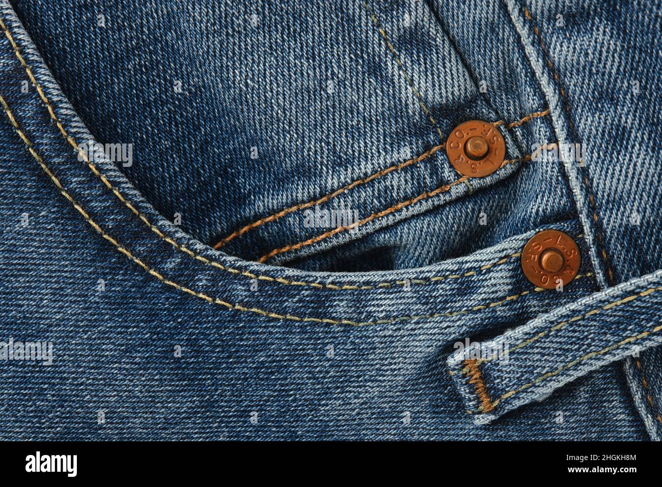 Close up of details of new LEVI'S 501 Jeans. Buttons and seams and pockets close-up. Classic jeans model. LEVI'S is a brand name of Levi Strauss and C Stock Photo