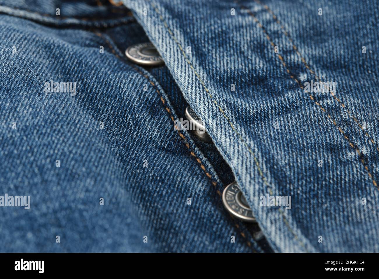 Close up of the details of new LEVI'S 501 Jeans. Buttons and seams close-up. Classic jeans model. LEVI'S is a brand name of Levi Strauss and Co, found Stock Photo