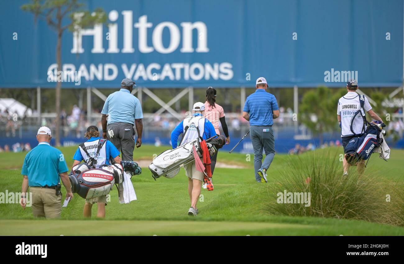 Orlando, FL, USA. 21st Jan, 2022. Group 9 consisting of Patty Tavatanakit of Thailand, Ryan Longwell and Sterling Sharpe walk down the 18th fairway during 2nd round of Hilton Grand Vacations Tournament of Champions held at Lake Nona Golf & Country Club in Orlando, Fla. Romeo T Guzman/CSM/Alamy Live News Stock Photo