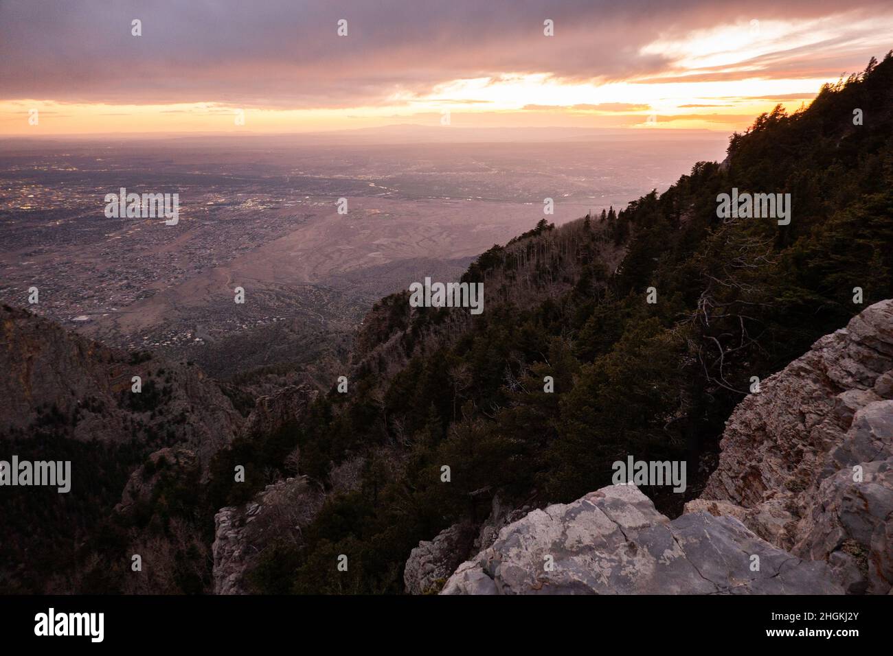 the city of Albuquerque, New Mexico, as seen from the top of the Sandia Mountains at sunset Stock Photo