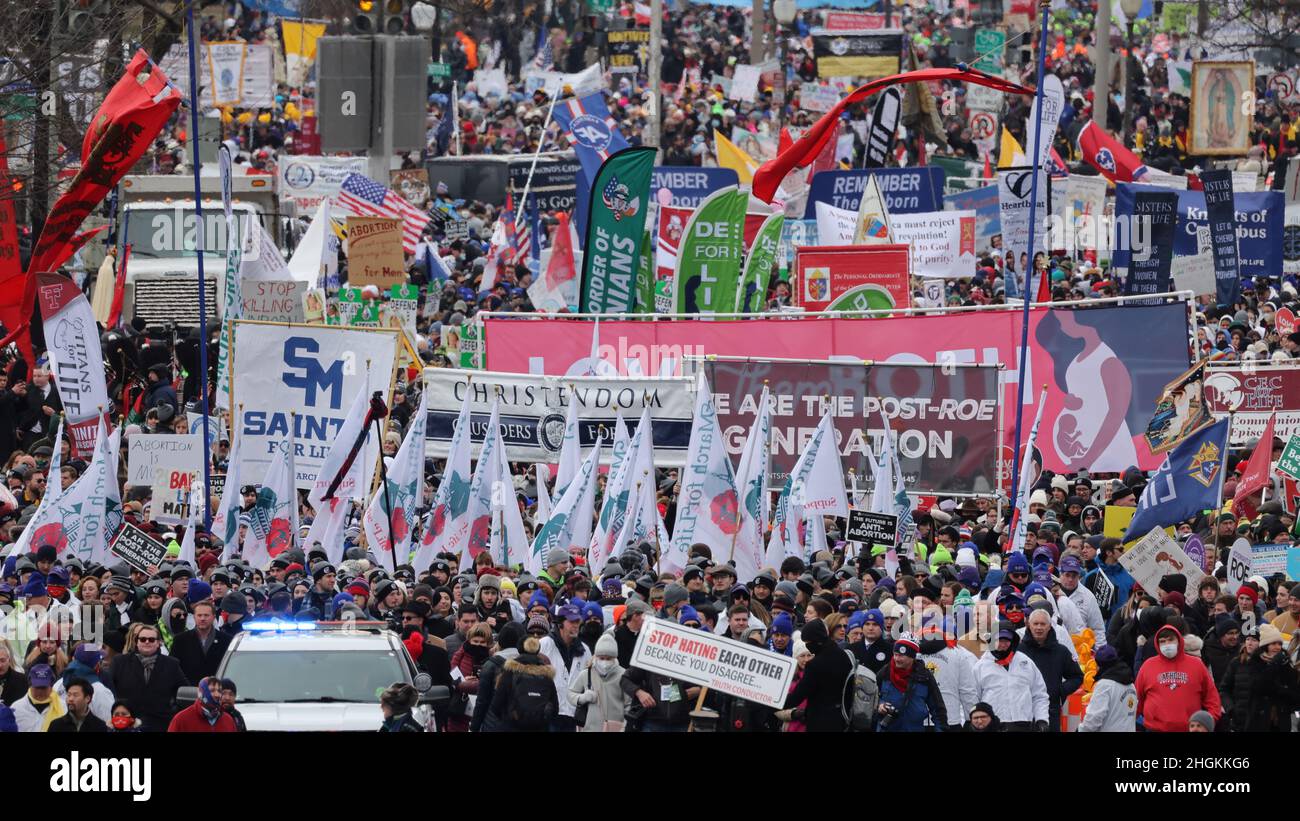 People hold banners and flags as they walk during the annual 'March for Life', in Washington, U.S., January 21, 2022. REUTERS/Jim Bourg Stock Photo