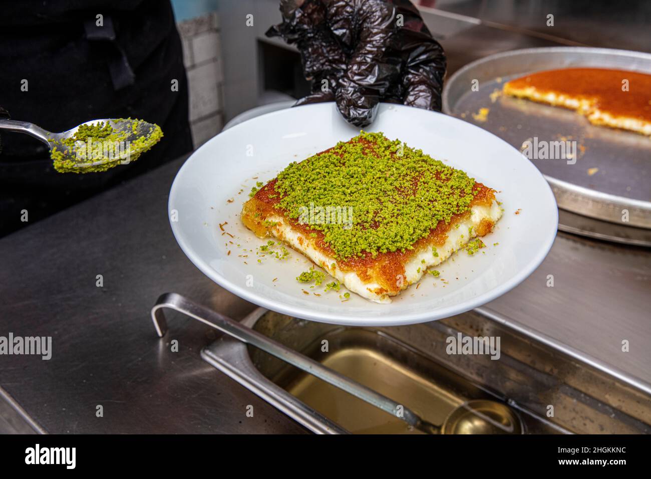 Turkish dessert künefe, künefe, peanut powder and cheese kadayif