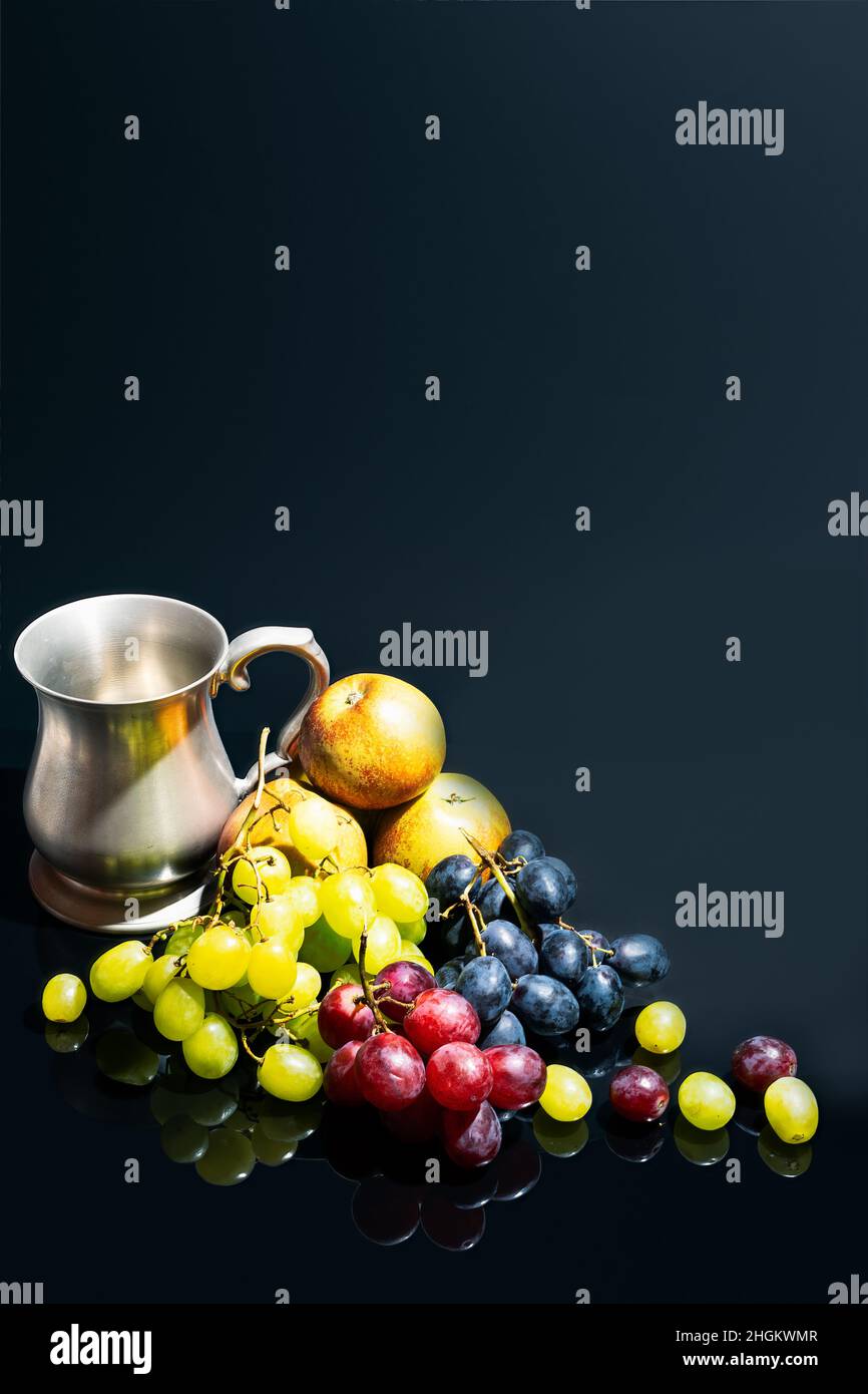 Apples, grapes and pewter beer tankard, still life Stock Photo