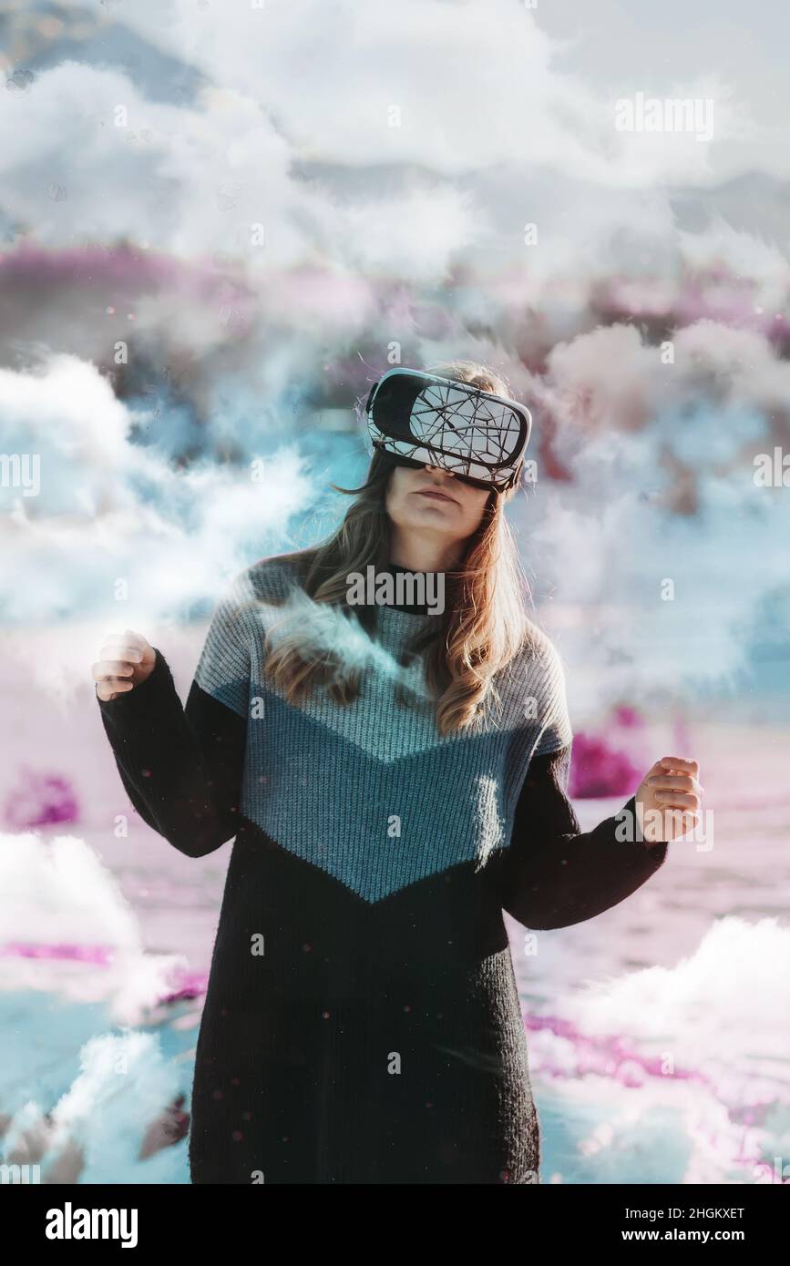 woman with vr goggles outdoors in surreal world enjoying vr experience Stock Photo