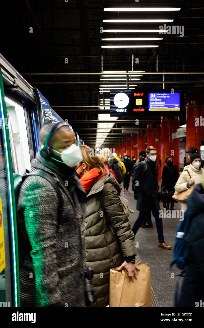 Munich, Germany. 20th Jan, 2022. U-Bahn riders pour out of a train at Odeonsplatz. While cases of Covid-19 continue to surge, there is resistance from both politicians and the public to put further restrictions in place. The seven-day incidence in the city of Munich has reached 1,122. Yet, many people could be seen shopping on the afternoon of January 21, 2022. (Photo by Alexander Pohl/Sipa USA) Credit: Sipa USA/Alamy Live News Stock Photo