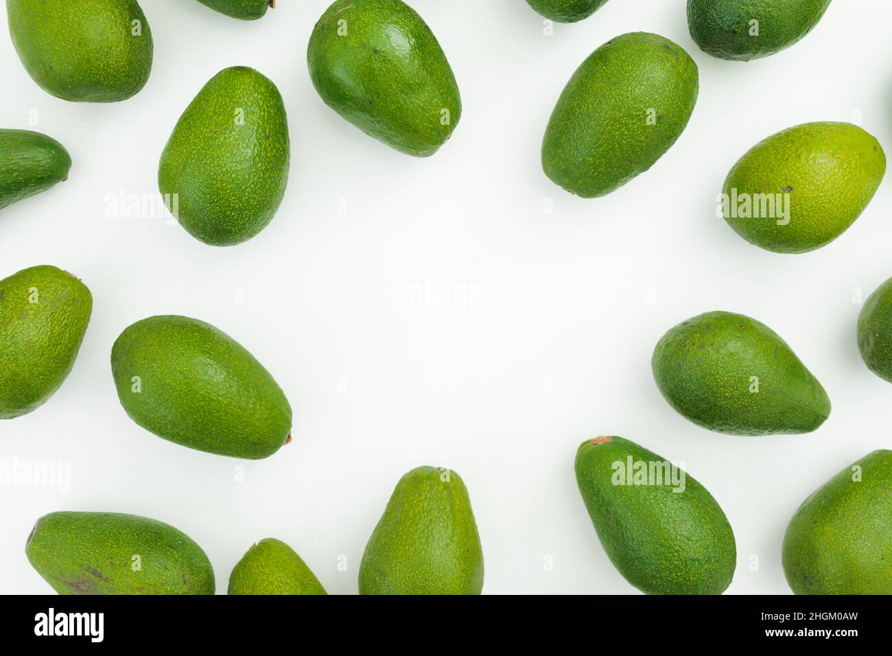 Avocados frame on white background. Flat lay, top view. Food concept. Stock Photo
