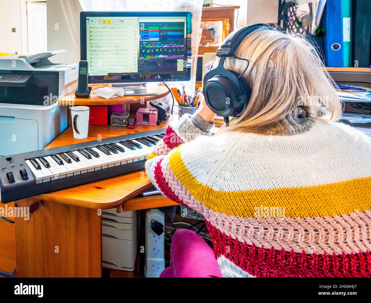 Music studio full of instruments and pc display Stock Photo - Alamy