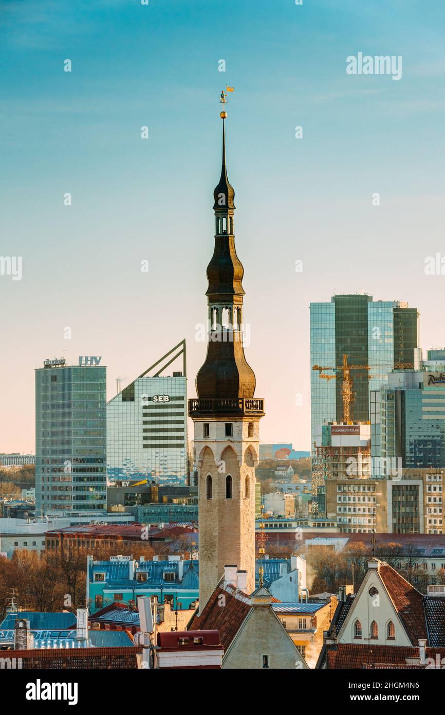 Tallinn, Estonia. View Of Tower Of Tallinn Town Hall On Background Of Modern Architecture. Oldest Town Hall In Baltic Region And Scandinavia. Stock Photo