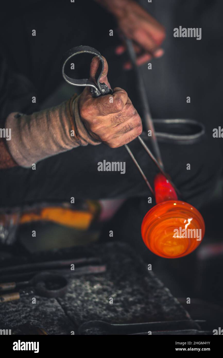 Glass production blowing in traditional industry glass factory in