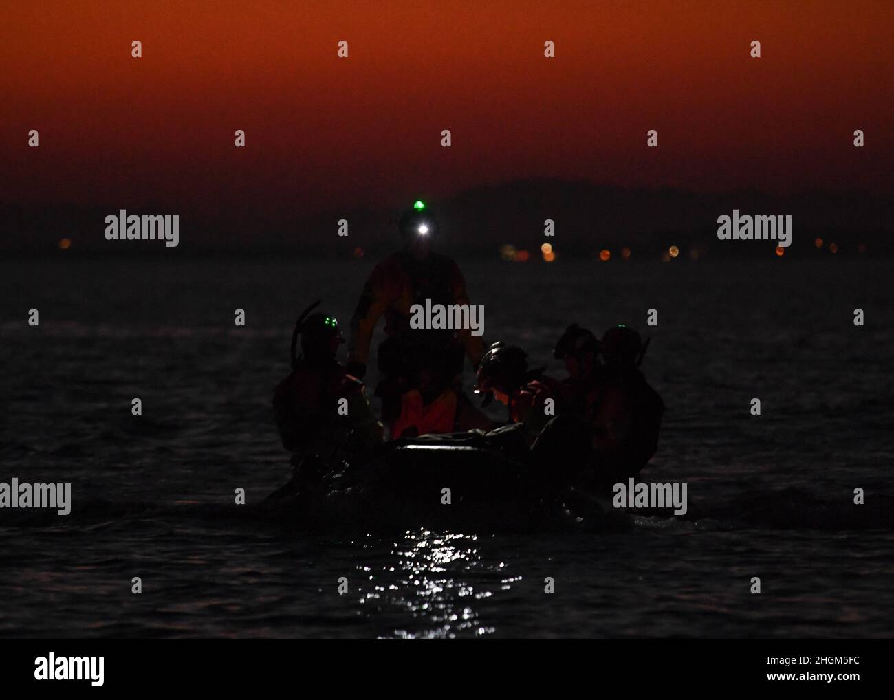 Pararescuemen assigned to the 57th Rescue Squadron finish putting ...