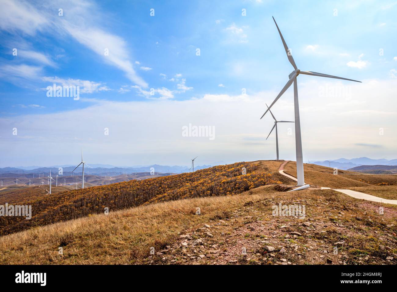Wind turbine landscape on the top of the mountain.Mountains and wind turbines scenery in the autumn season. Stock Photo