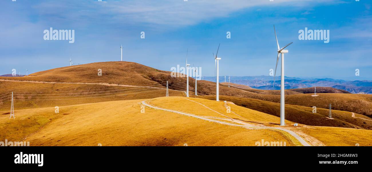 Wind turbine landscape on the top of the mountain.Mountains and wind turbines scenery in the autumn season. Stock Photo