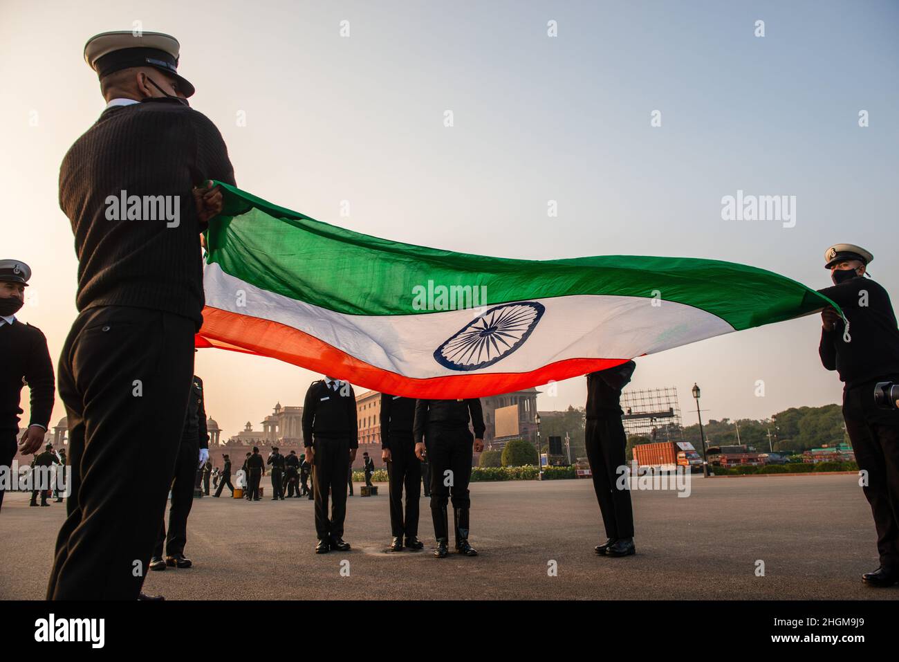 New Delhi, India. 21st Jan, 2022. Indian navy personnel practice flag hosting ceremony during the Beating retreat rehearsal at Vijay Chowk. Beating the Retreat ceremony is a century old military tradition. In early 1950 Major Roberts of the Indian Army indigenously developed the unique ceremony of display by the massed bands, when the troops ceased fighting, sheathed their arms and withdrew from the battlefront and returned to the barracks at sunset at the sounding of the Retreat. Credit: SOPA Images Limited/Alamy Live News Stock Photo