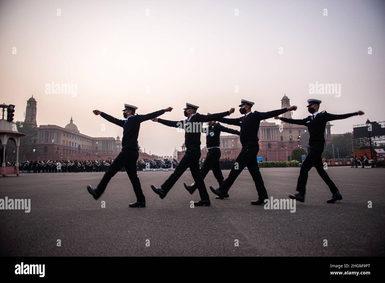 New Delhi, India. 21st Jan, 2022. Indian navy personnel practice flag hosting ceremony during the Beating retreat rehearsal at Vijay Chowk. Beating the Retreat ceremony is a century old military tradition. In early 1950 Major Roberts of the Indian Army indigenously developed the unique ceremony of display by the massed bands, when the troops ceased fighting, sheathed their arms and withdrew from the battlefront and returned to the barracks at sunset at the sounding of the Retreat. (Photo by Pradeep Gaur/SOPA Images/Sipa USA) Credit: Sipa USA/Alamy Live News Stock Photo