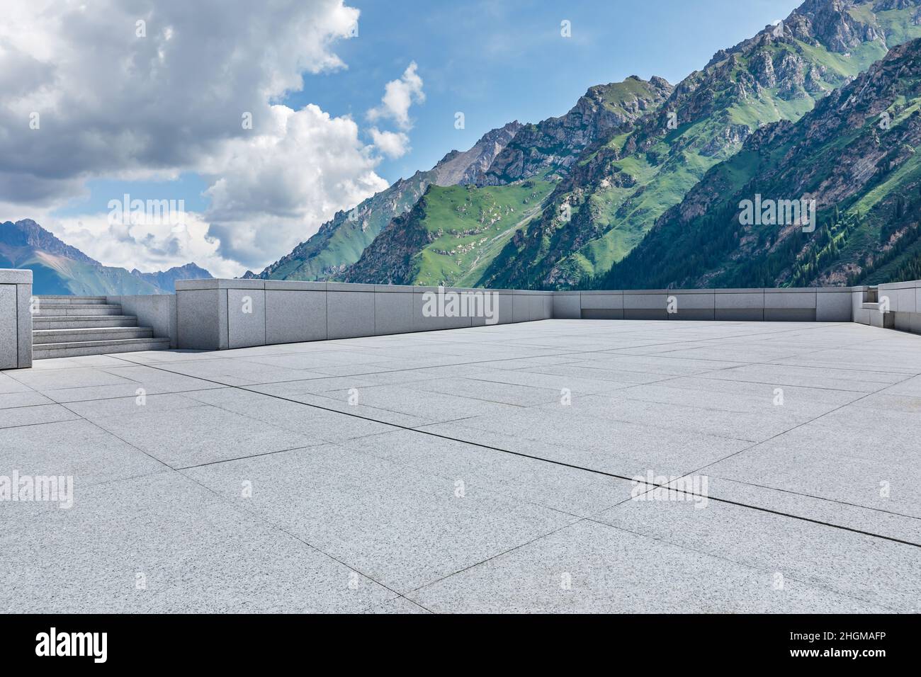 Empty square floor and green mountain background. Stock Photo