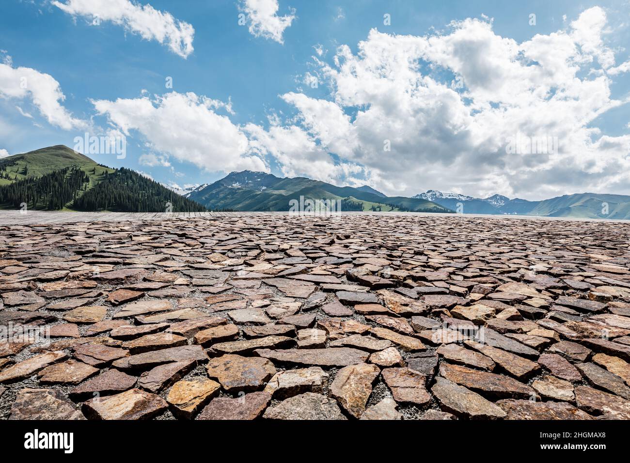 Empty square floor and mountains under blue sky Stock Photo