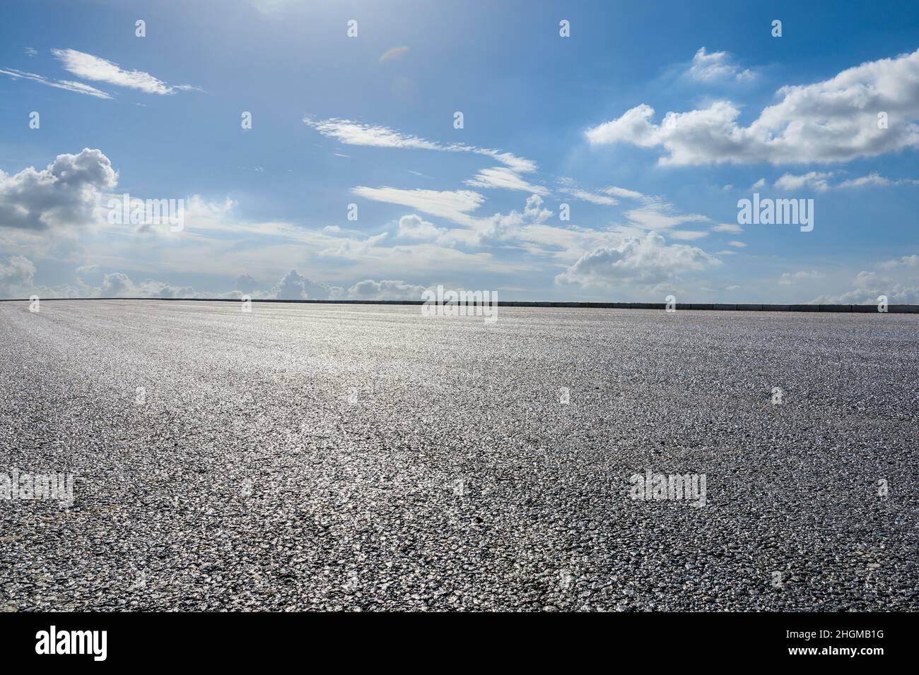 Empty asphalt road under blue sky Stock Photo - Alamy
