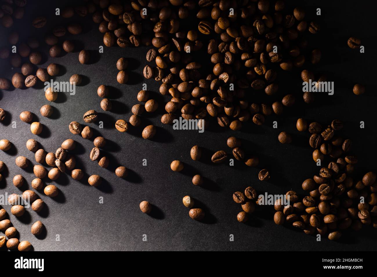 coffee beans on black background Stock Photo - Alamy