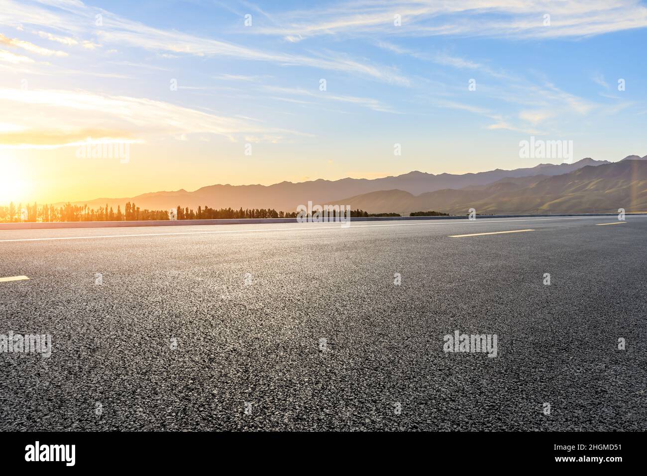 Empty asphalt road and mountain scenery at sunrise Stock Photo - Alamy