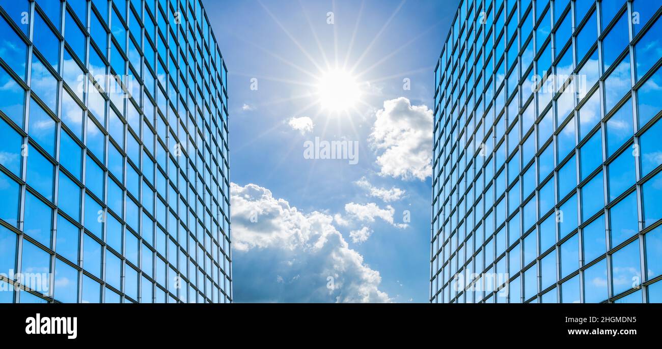 Modern office building with glass facade on a clear sky background ...