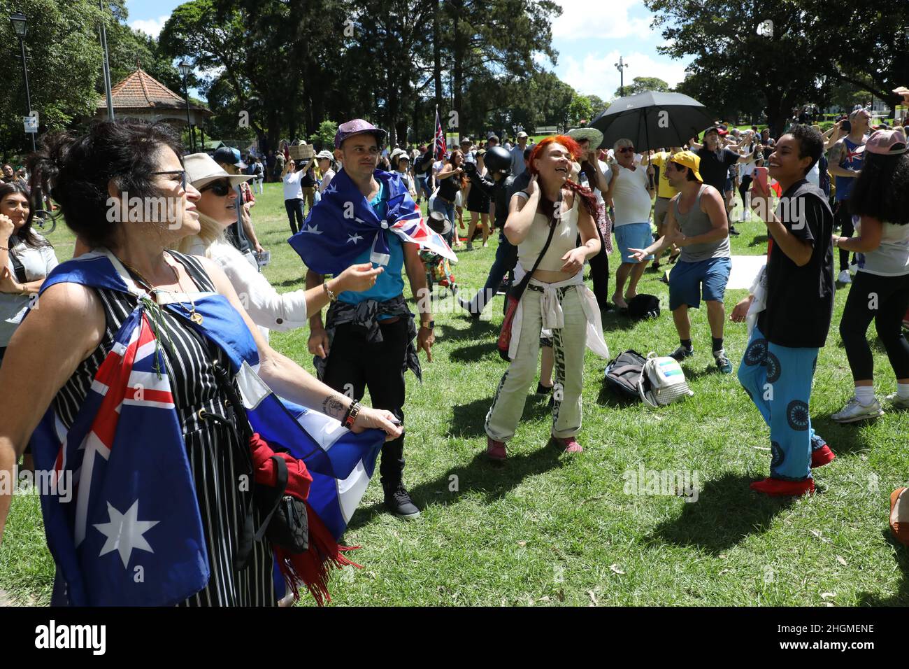 Sydney, Australia. 22nd January 2022. Protesters in support of freedom and against mandatory vaccines and medical apartheid marched from Strathfield Station to Burwood Park as part of the World Wide Rally for Freedom. Pictured: at the end of the rally protesters in Burwood Park dance in defiance of the NSW government’s draconian laws banning singing and dancing. Credit: Richard Milnes/Alamy Live News Stock Photo