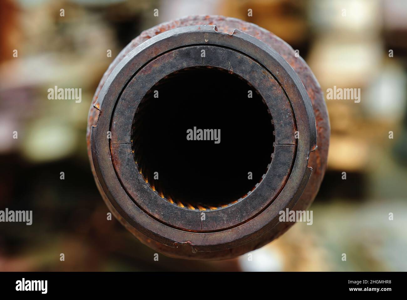 A big gun. The rifled gun of the tank. Close-up of a tank gun barrel with rifling. Abstract background of the armed conflict. Stock Photo