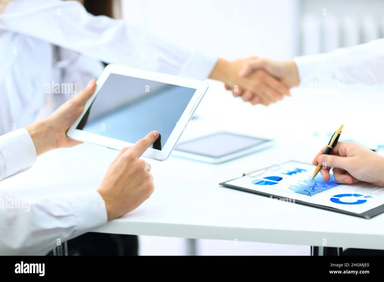 transaction was completed. businessmen shake hands. Stock Photo
