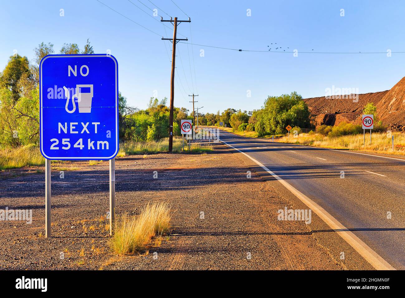 Large warning road sign no fuel next 250 kilometers on a highway off