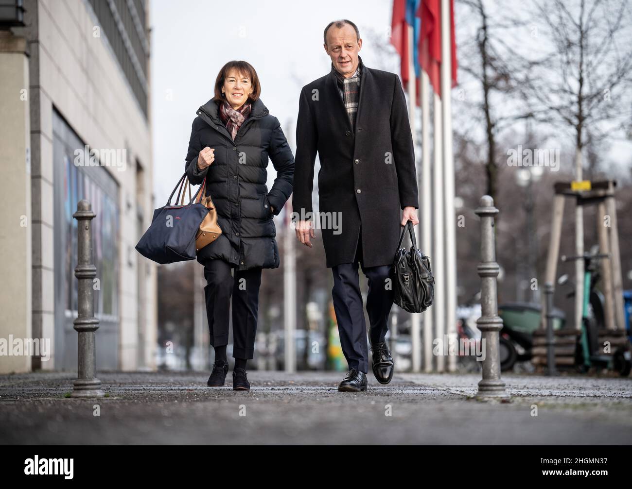 Berlin, Germany. 22nd Jan, 2022. Friedrich Merz, candidate for the post of CDU federal chairman, arrives alongside his wife Charlotte for the CDU's federal party conference at Konrad Adenauer Haus. At the 34th CDU party congress, Merz is to be elected as the new federal chairman and successor to Laschet. Due to the pandemic, the party convention will be held purely digitally. Credit: Michael Kappeler/dpa/Alamy Live News Stock Photo