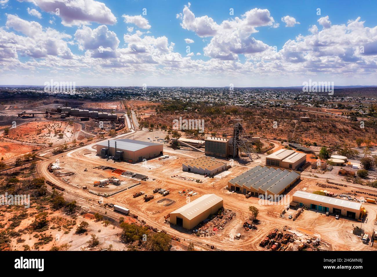 Open pit minerals and metal ore Junction Mine in Broken hill silver city - elevater aerial cityscape. Stock Photo