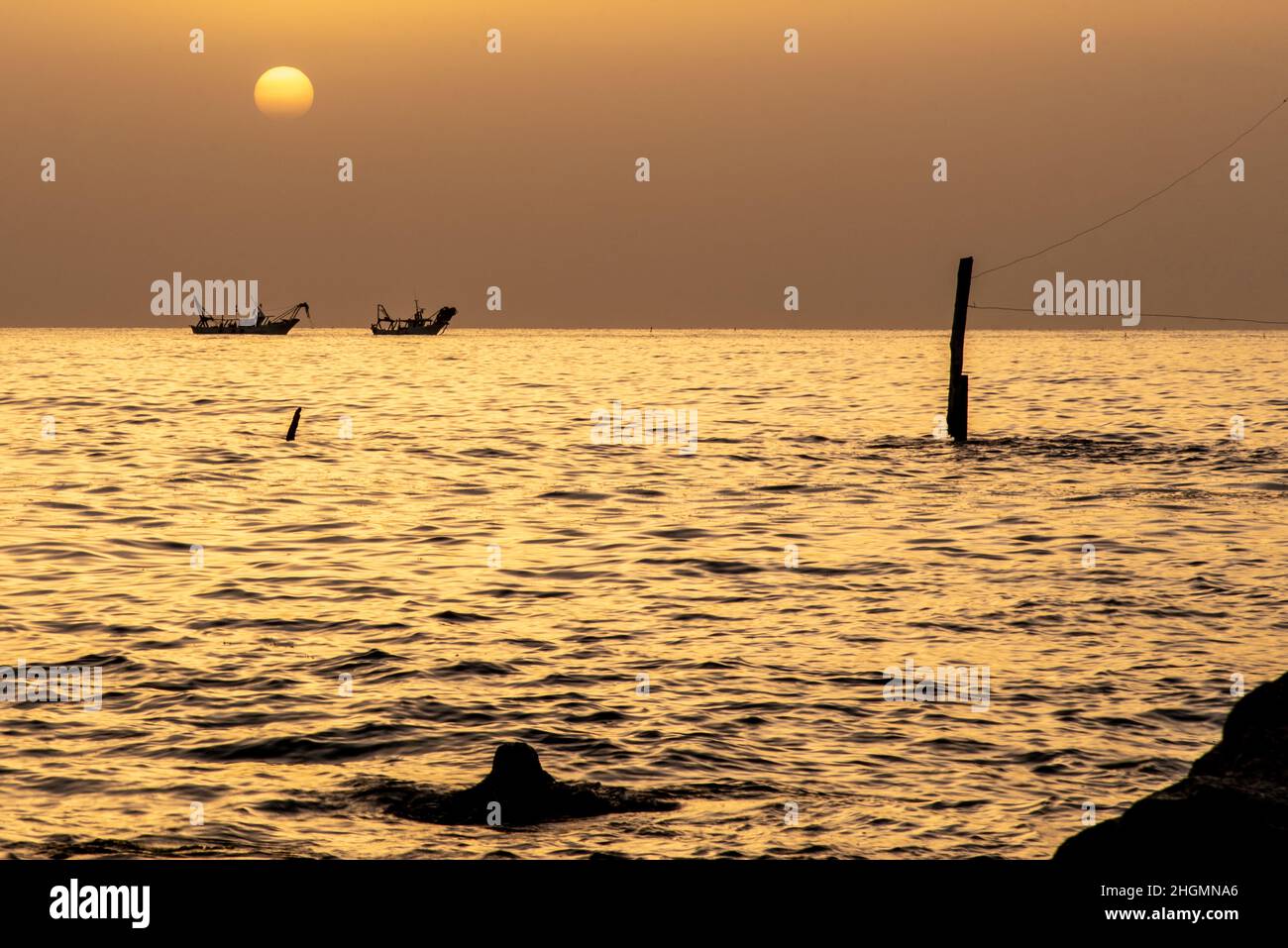 June 2021, Abruzzo, Italy. Trabocchi coast. Fishing boats return to port at dawn. Stock Photo