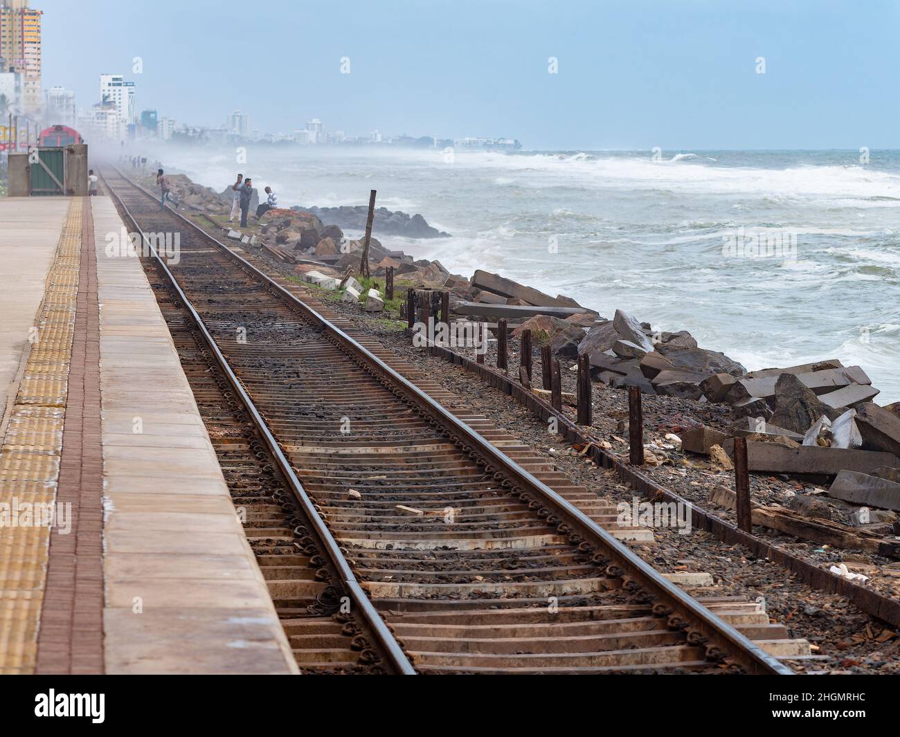 Platform and the sea at Kollupitiya Railway Station in Colombo, Sri Lanka. The station is one of the busiest railway stations on the Coastal railway l Stock Photo