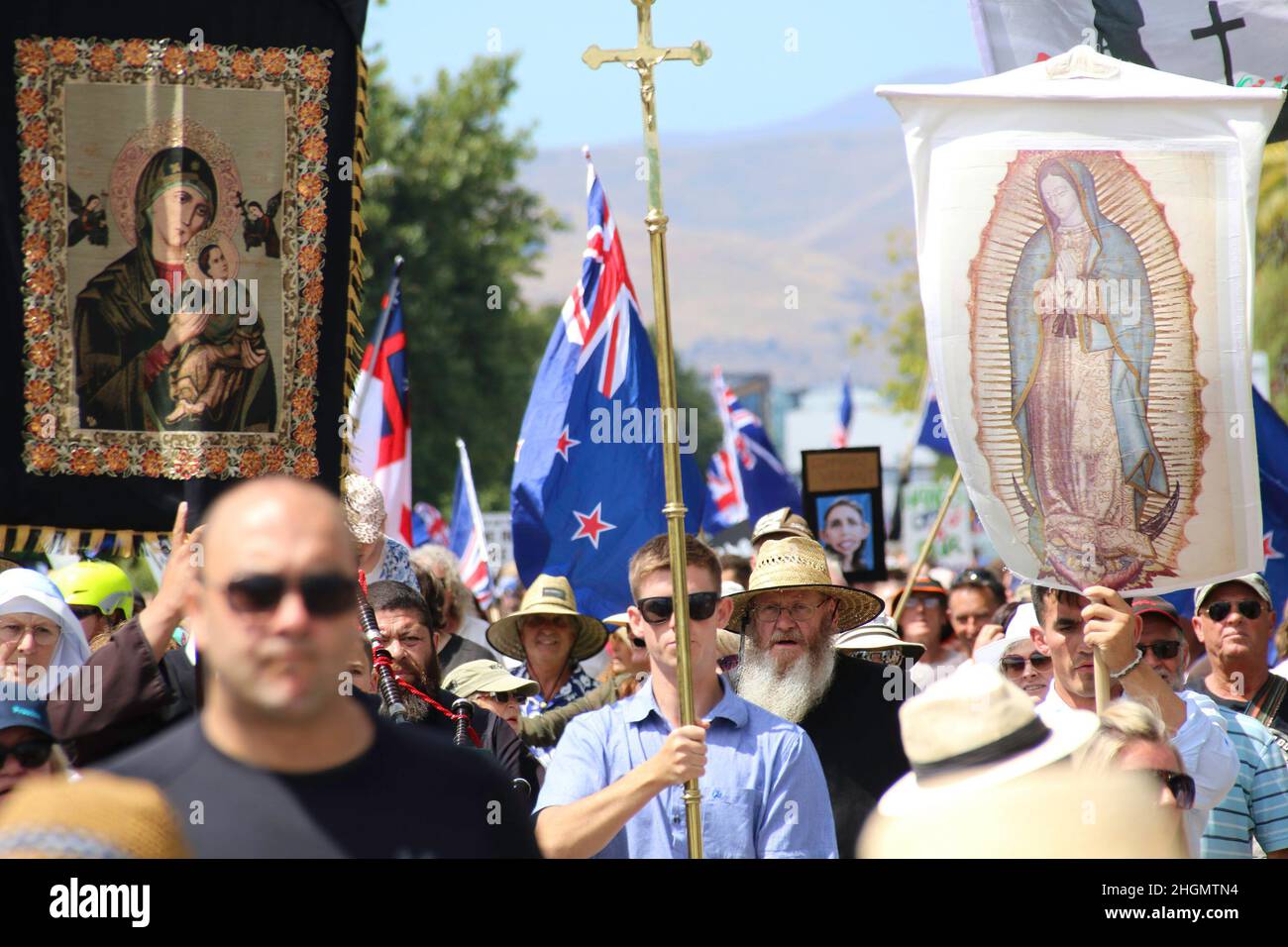 Christchurch, New Zealand. 22nd Jan, 2022. Protesters with Christian religious symbols and pictures were seen during the antivax protest in Merivale. Protesters take to the streets in the affluent suburb of Merivale in protest against the mandatory Covid19 vaccination. Credit: SOPA Images Limited/Alamy Live News Stock Photo