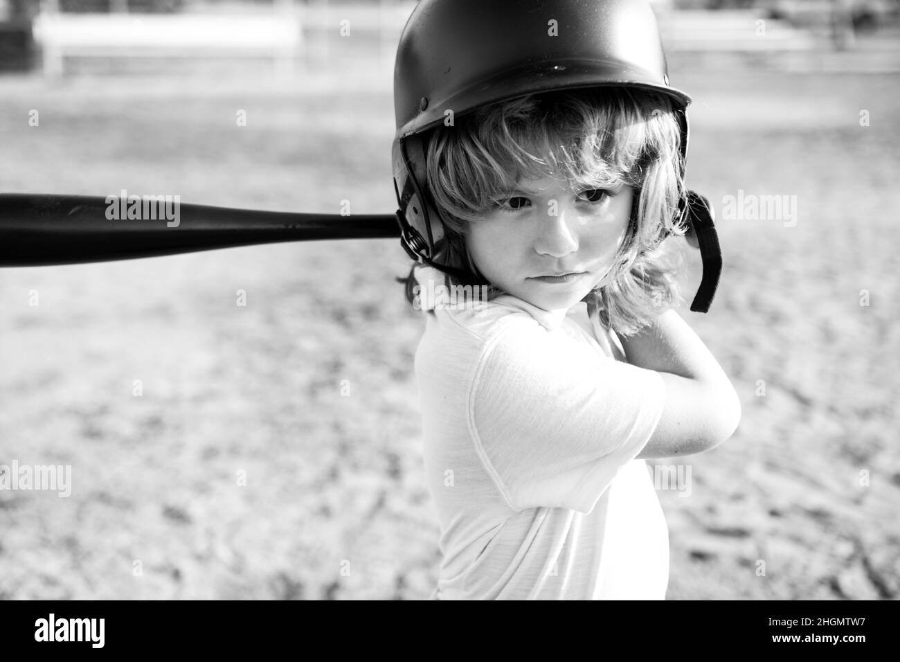 Child baseball player focused ready to bat. Kid holding a baseball bat Stock Photo Alamy