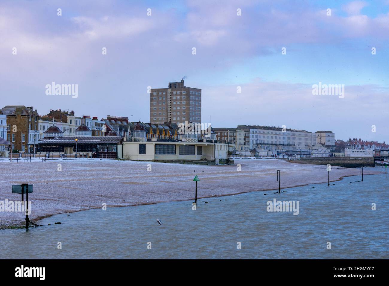 Herne Bay - The view from Neptune's Arm, looking towards the Bandstand and the beach with a sugar coating of snow on it in February 2021. Stock Photo