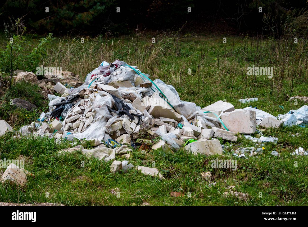 Illegal construction waste dump in nature Stock Photo