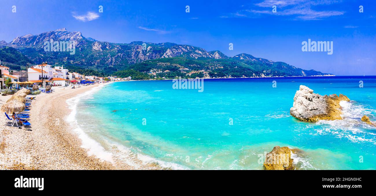 Samos island, Greece. Beautiful beach in scenic Kokkari village. popular tourist destination for summer holidays Stock Photo