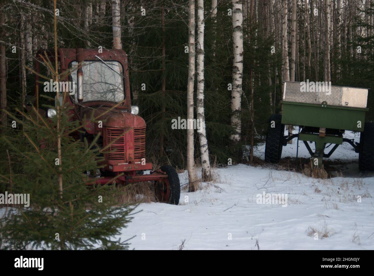 Abandoned tractor in the forest Stock Photo